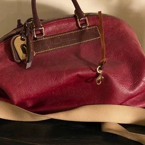 Leather duffel bag with long cross body strap